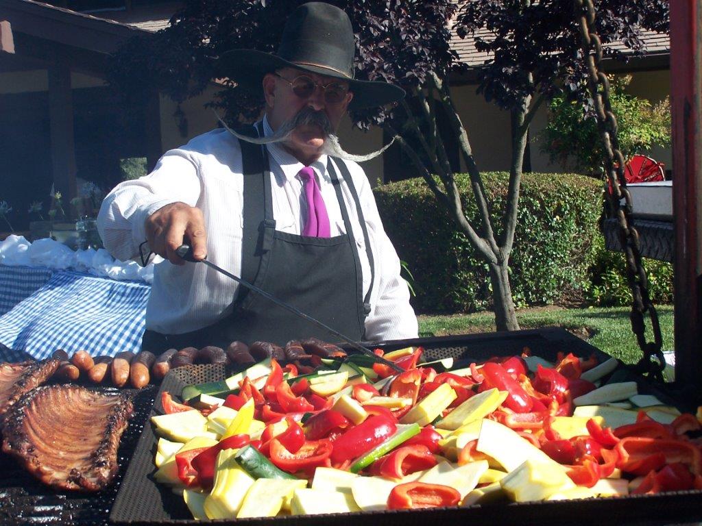 Billy turning vegetables on the grill